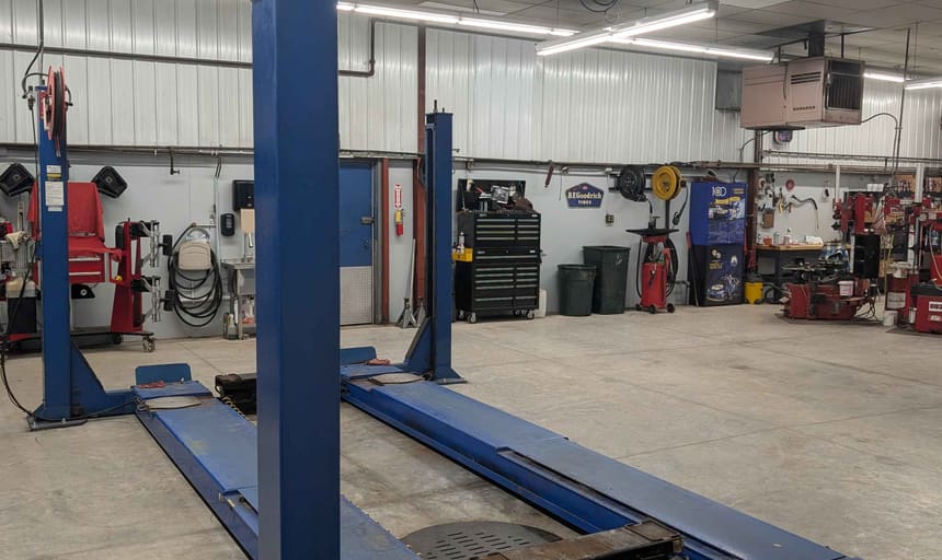 Four-post wheel alignment rack used for suspension and steering service at Seiler Tire